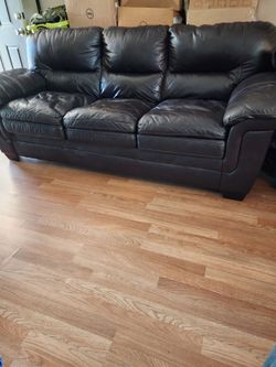Very real leather couch moving i can help you load it.