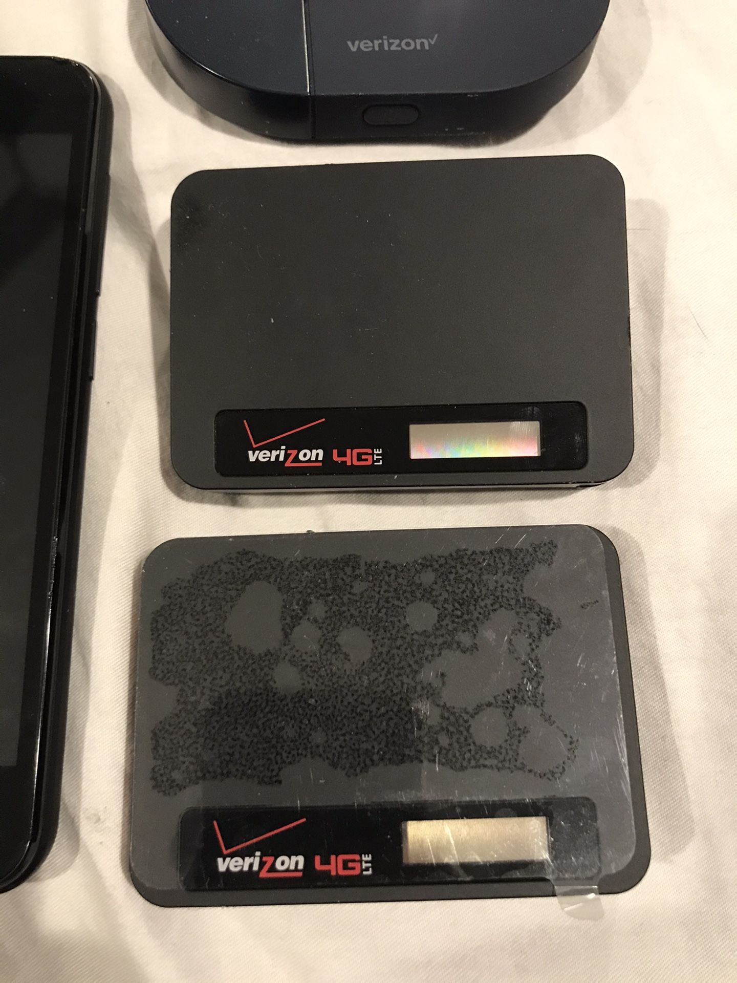 Three Verizon wireless hotspot. And one phone