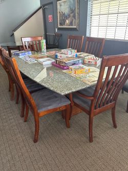 Solid granite table or conference table with up to 8 wood chairs