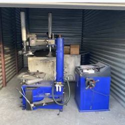 A machine for changing tires, and another for balancing.
