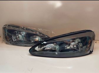 2004-2008 PONTIAC GRAND PRIX GT BLACK HALOGEN HEADLIGHT PAIR