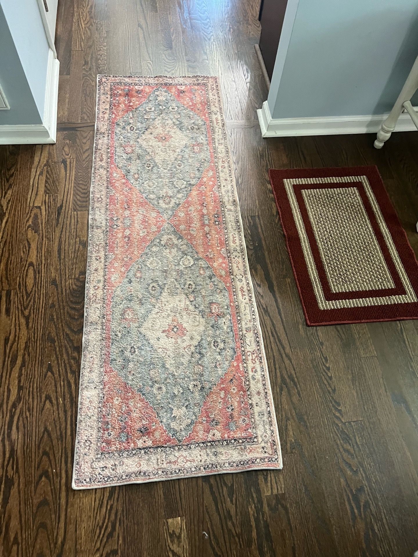 2 red pattern rugs