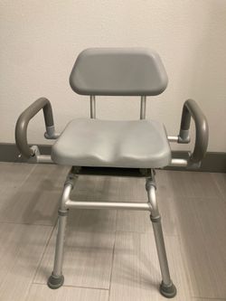 Adjustable shower chair swivel seat for pivoting into bathtubs.