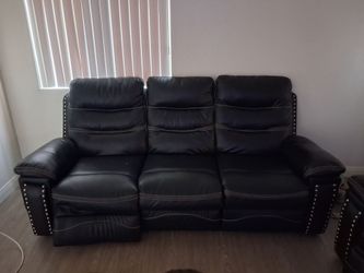 Leather sofa and love seat with phone chargers on both ends
