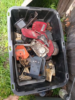2 bins of trailer lights and chainsaw parts