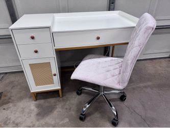 Desk with drawers and rolling chair.