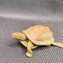 Antique-style, feng shui-inspired decorative turtle figurine.