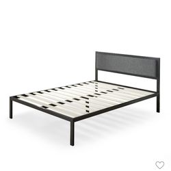 Platform metal bed frame with gray upholstered headboard