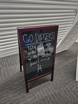 A frame blackboard sign with markers