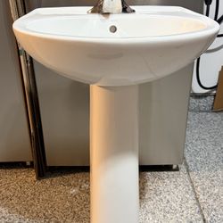 Sterling pedestal bathroom sink in white. Includes the chrome MOEN faucet