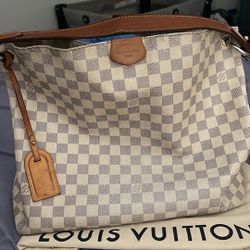 Louis Vuitton hobo shoulder bag.