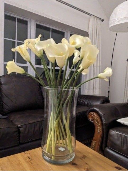 10 Lilies In A Tall Glass Vase