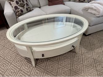 Glass top oval coffee table