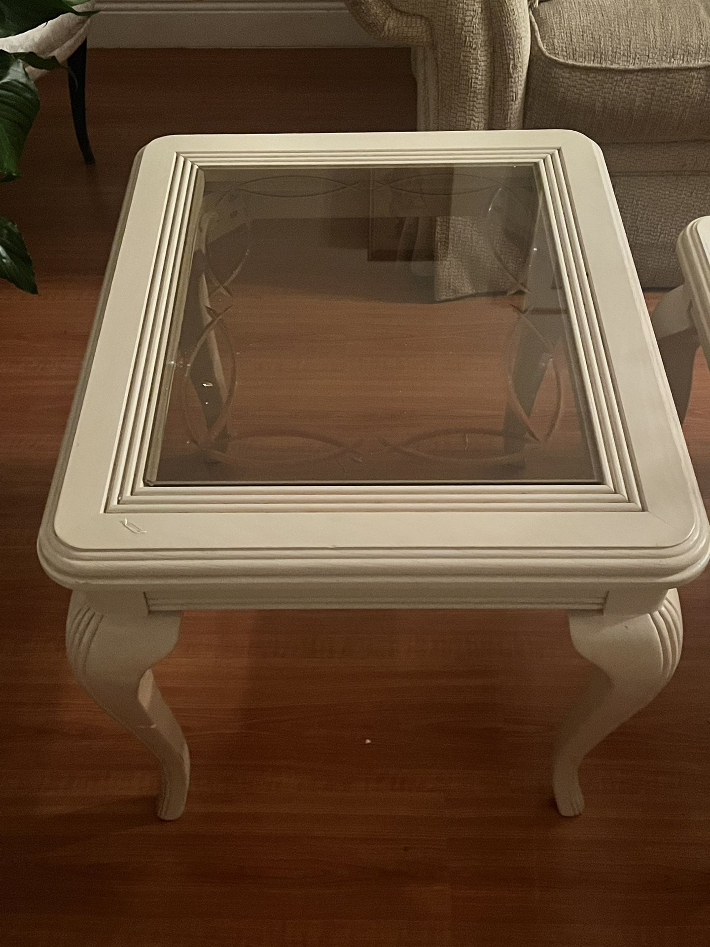 Light wooden coffee and end table with glass