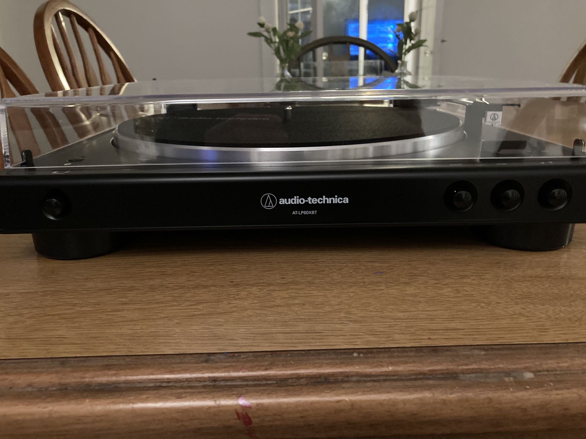 Audio Technica AT-LP60XBT record player with album