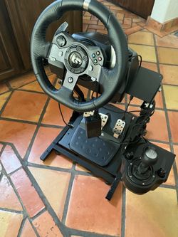 Gaming wheel with pedals, shifter and stand.