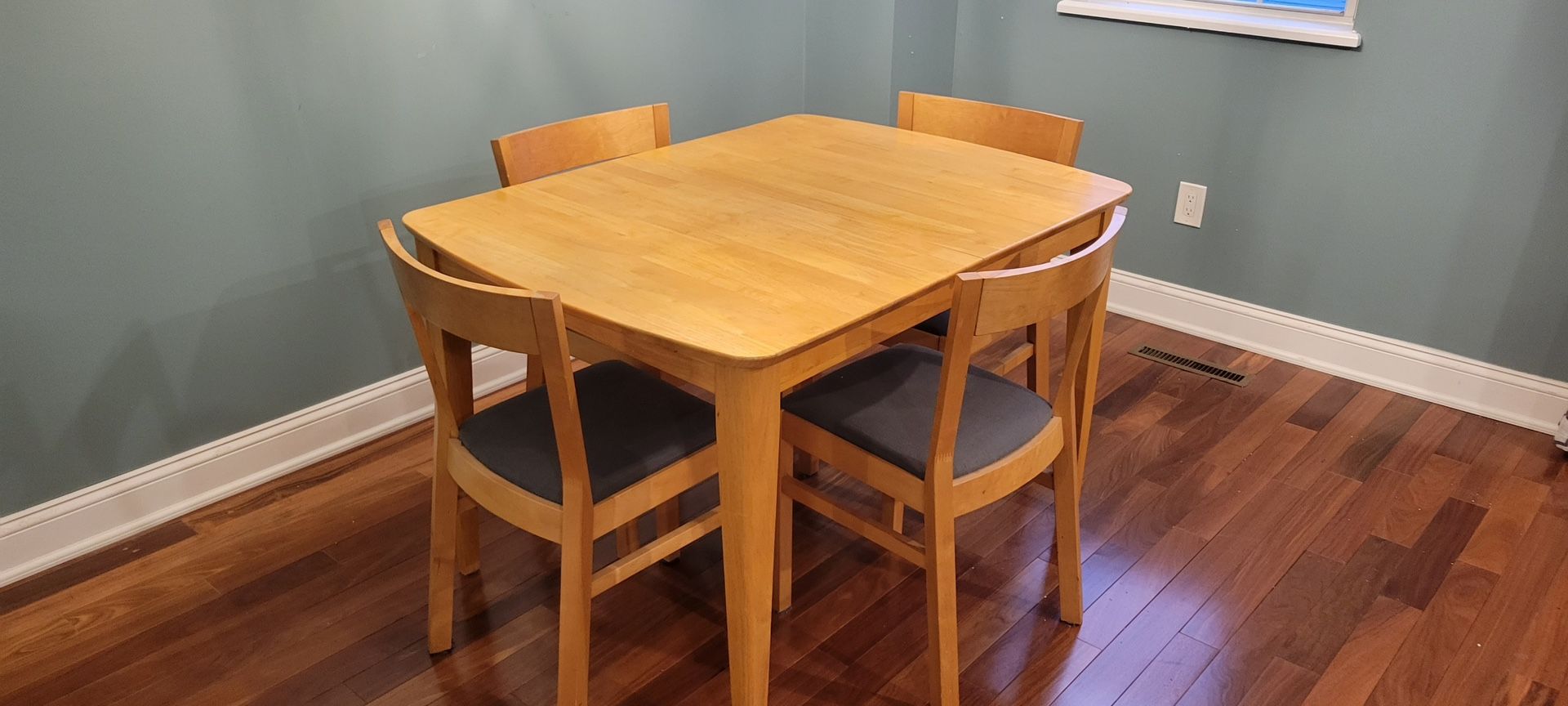 Kitchen Table with Four Chairs and Extension Leaf.