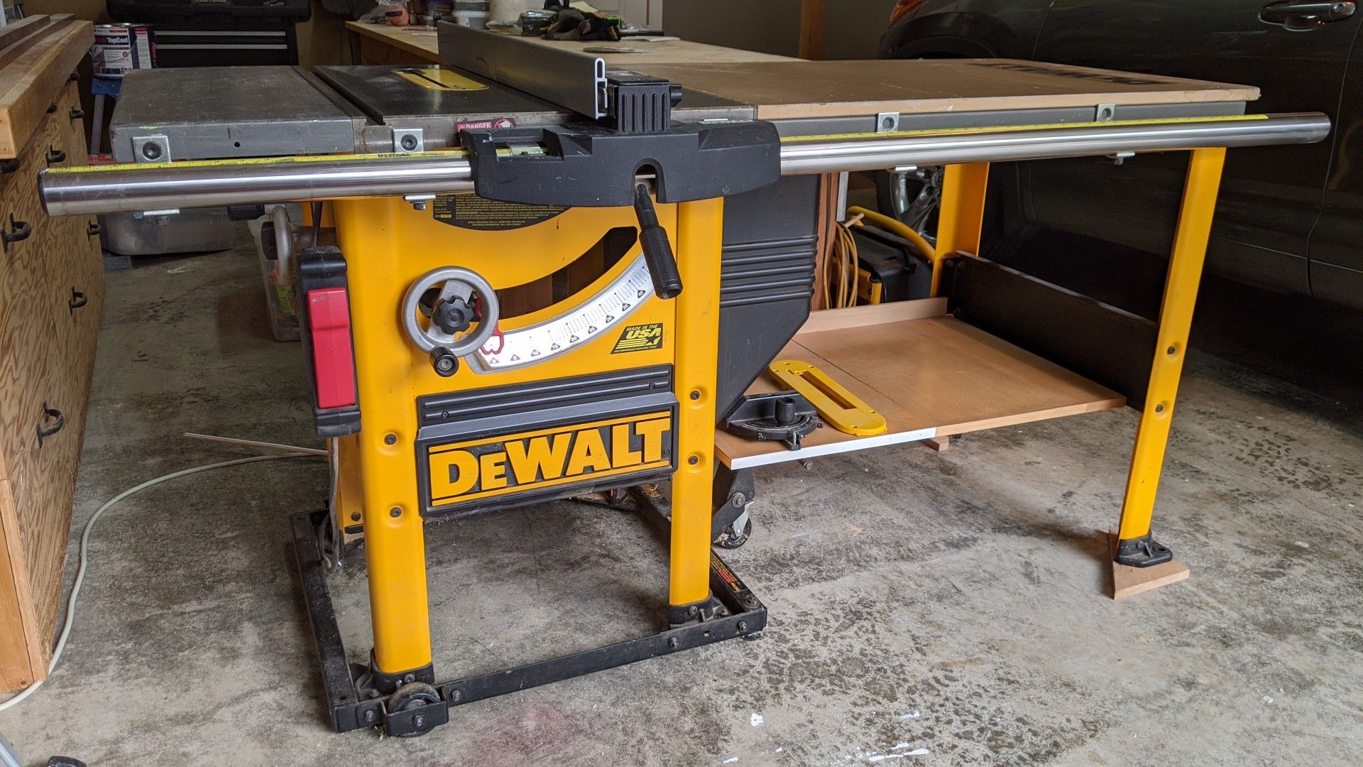 DeWalt 10" table saw with 52" rip capacity. Works great.