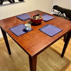 Brown wooden dining room table 