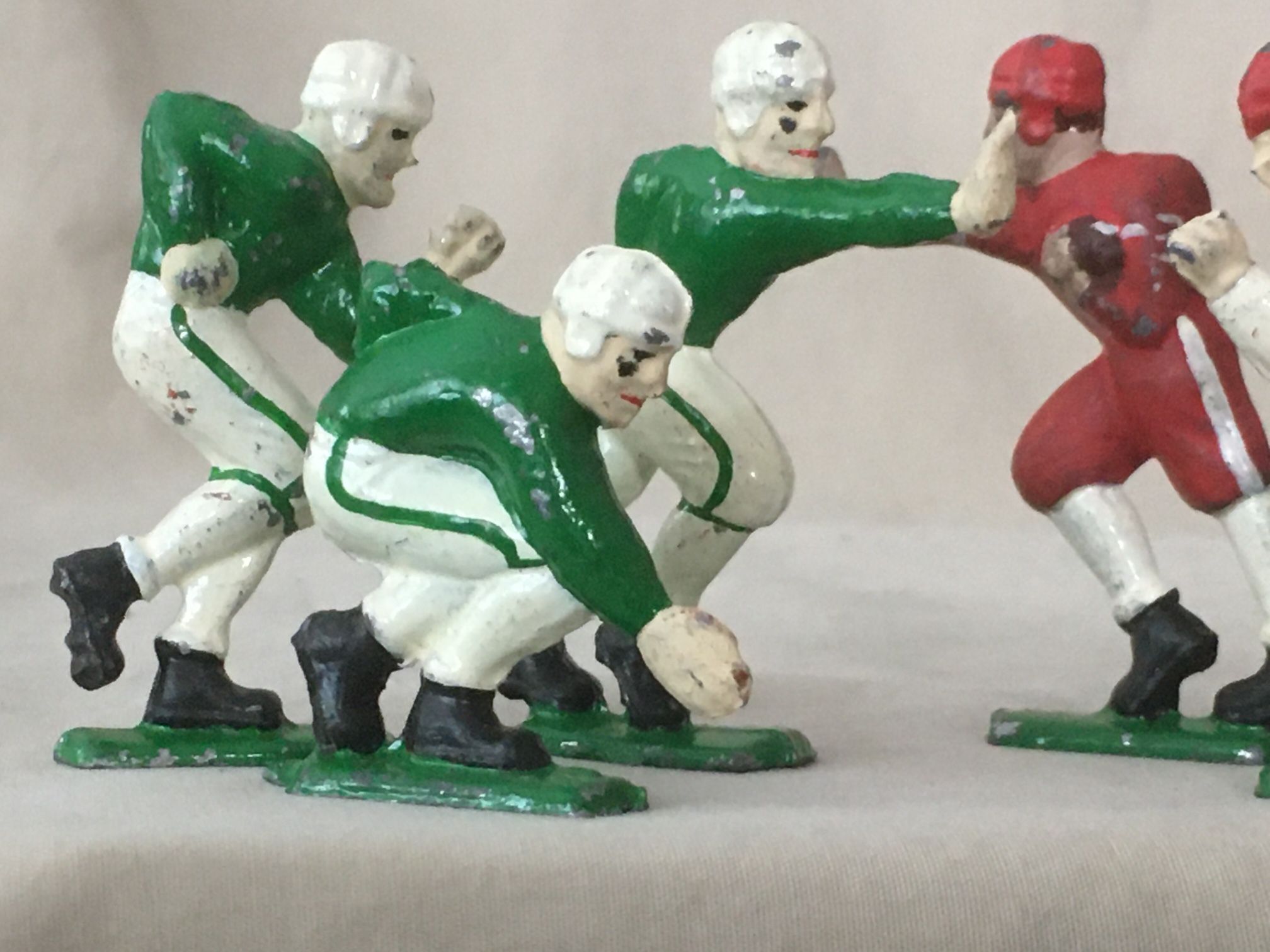 6 Antique Cast Iron Football Players