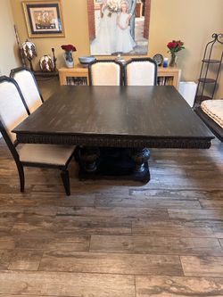 Square black dining table with chairs