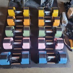 A Multi-Color Adjustable Dumbbell pair From 5 To 70lbs  $500. I'll include stand for a total of $550.