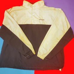This Vintage 80s Izod XL Lacoste Colorblock two pockets Windbreaker is a stylish and retro choice for men looking to add some flair to their casual wa