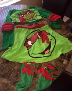 Size 10/12 kids ninja turtle costume firm price