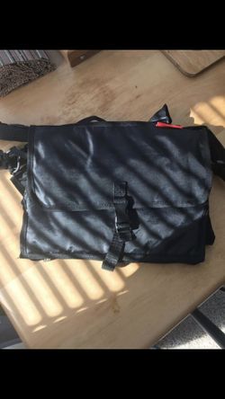 Smalla diaper bag with attached changing mat