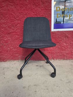 Charcoal gray rolling office chair in great condition,  clean as well