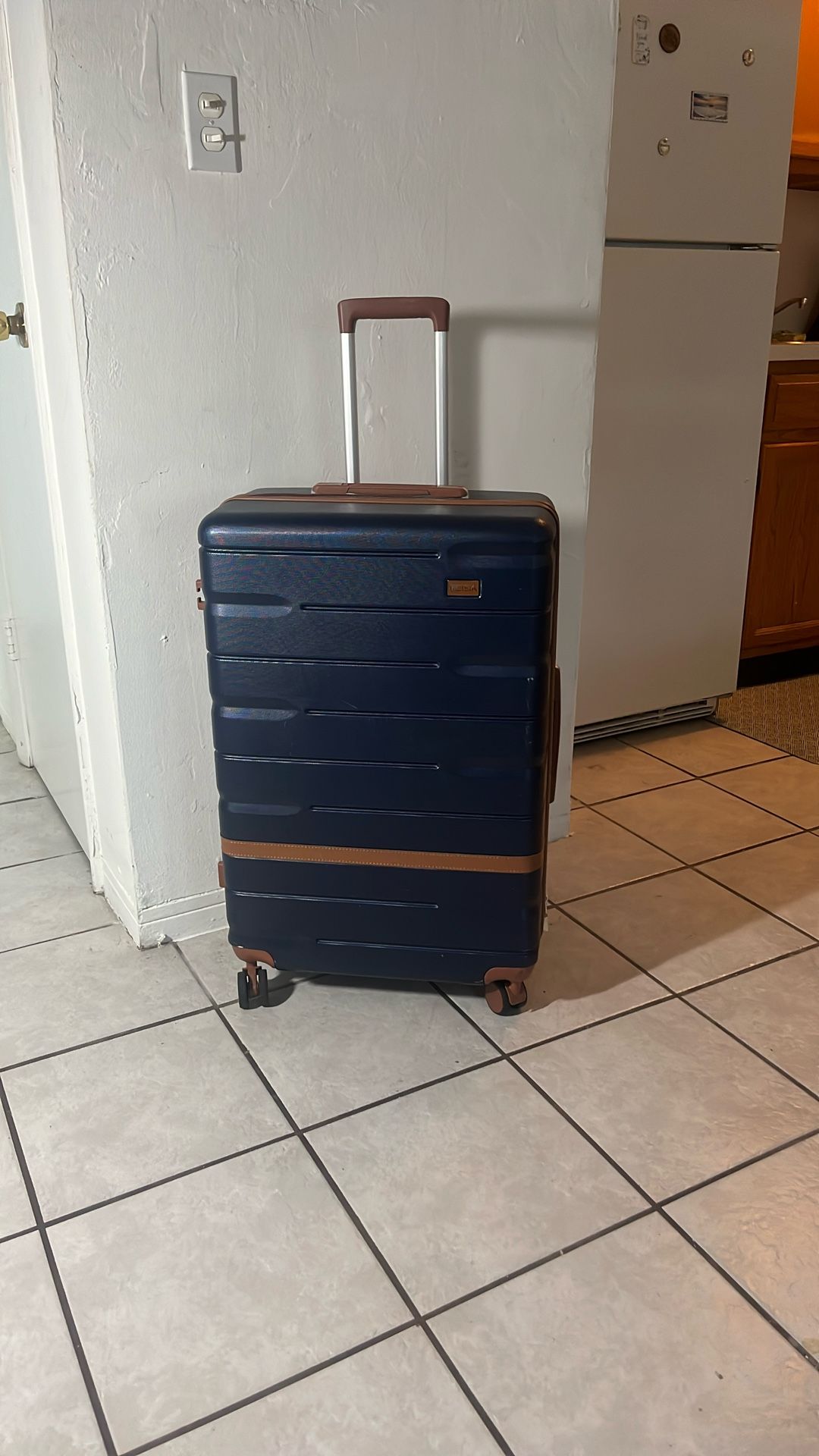 Large Hard Blue Suitcase with measurements.