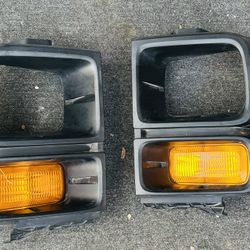 Pair Of Headlight Trim Bezels With Parking And Turn Signal Lights