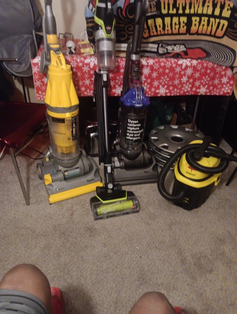 Dyson's Vacuum Upright Vacuum Cleaner And A Stanley Tub Cleaner