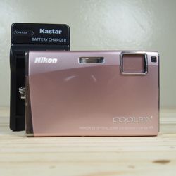 Nikon Coolpix S60 10.0MP Digital Camera Bundle Pink w/Charger + Battery Tested Comes with: Camera Charger Battery Wrist Strap *ask for a memory card a