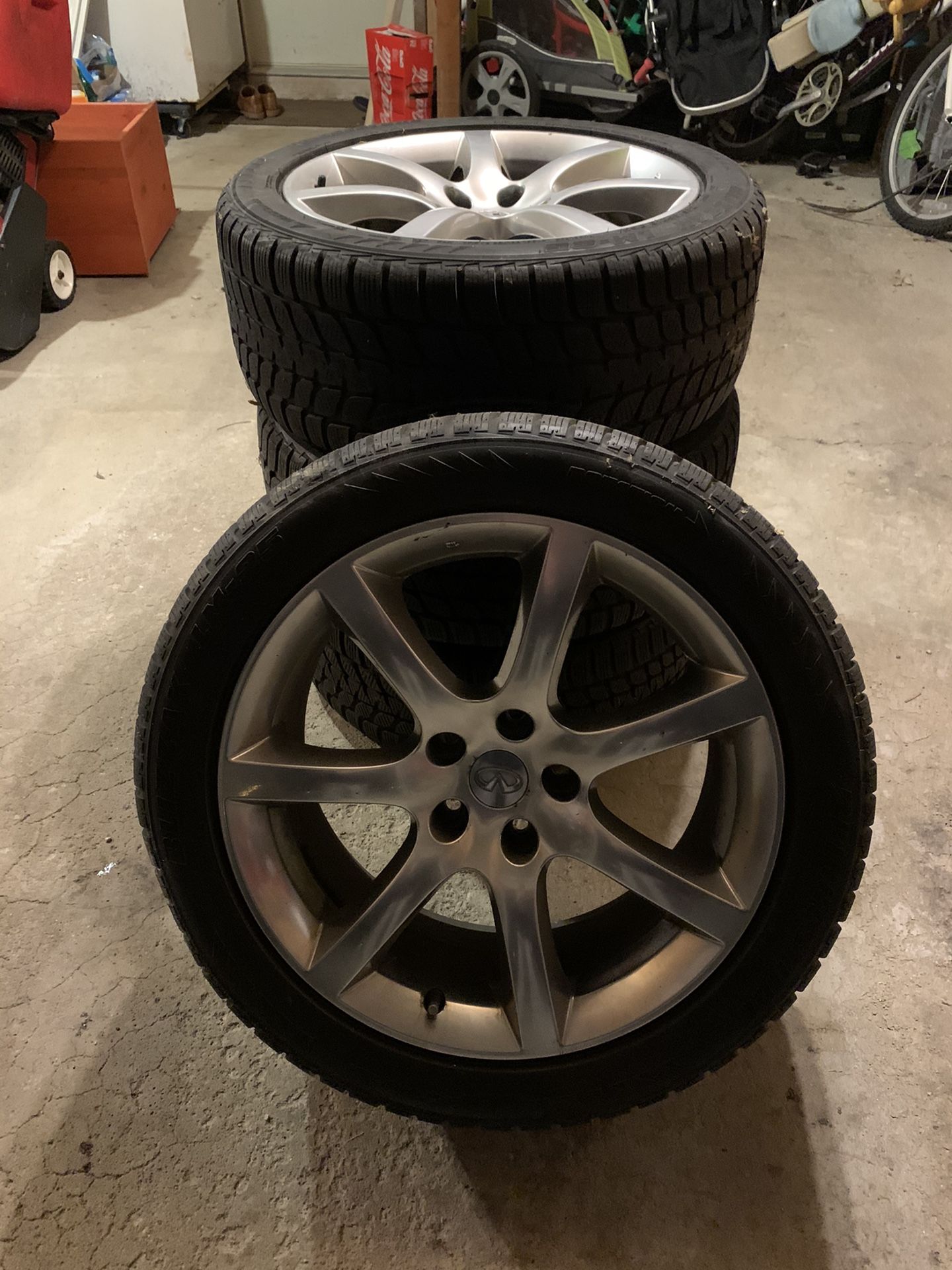 (4) Bridgestone Blizzak LM-25V 245/45/18 Snow Tires with Infiniti rims