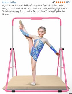 Kids gymnastics bar with mat
