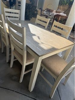 Free table of 6 chairs!