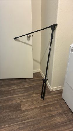 Amazon Basics microphone stand with a tripod base.