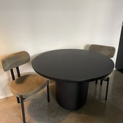 Cb2 Table With 2 Green chairs 