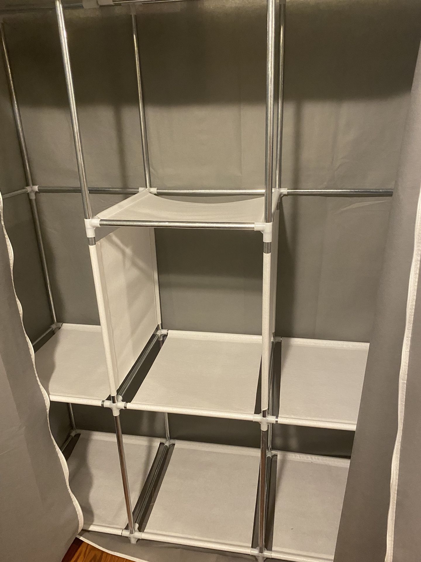 Closet Organizer, Has Poles For Hanging