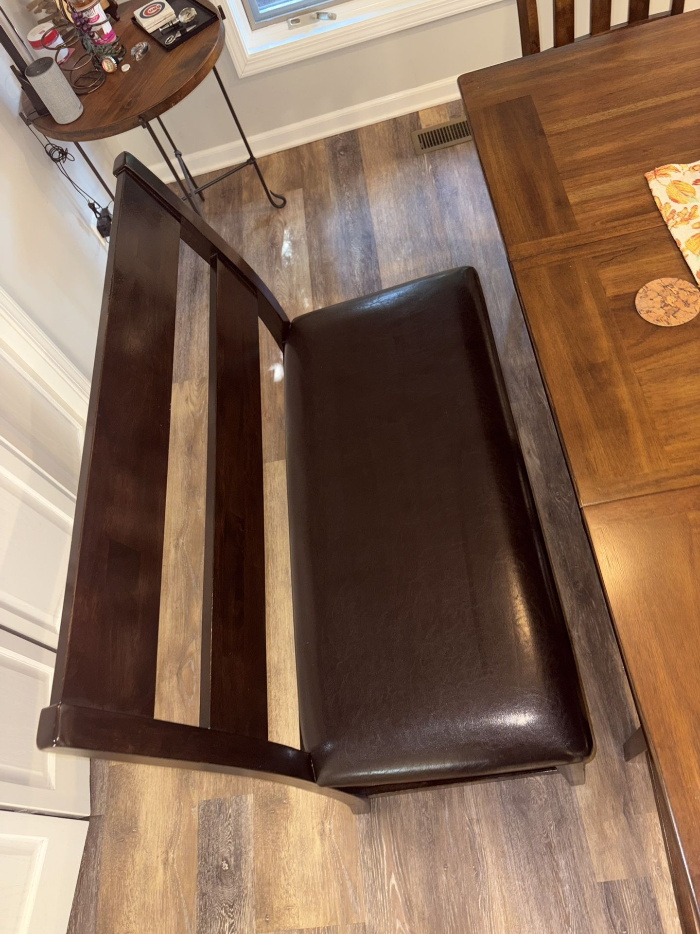 Ashley furniture, dining bench, dark brown wood, black leather seat excellent excellent condition measurements are in the pictures