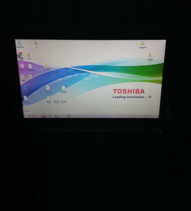 Toshiba laptop with charger and bag