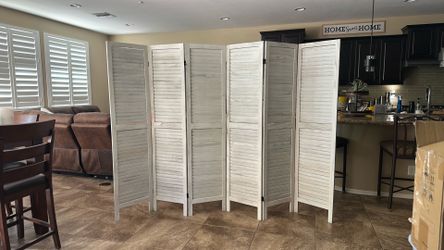 Freestanding, multi-panel louvered wooden room divider