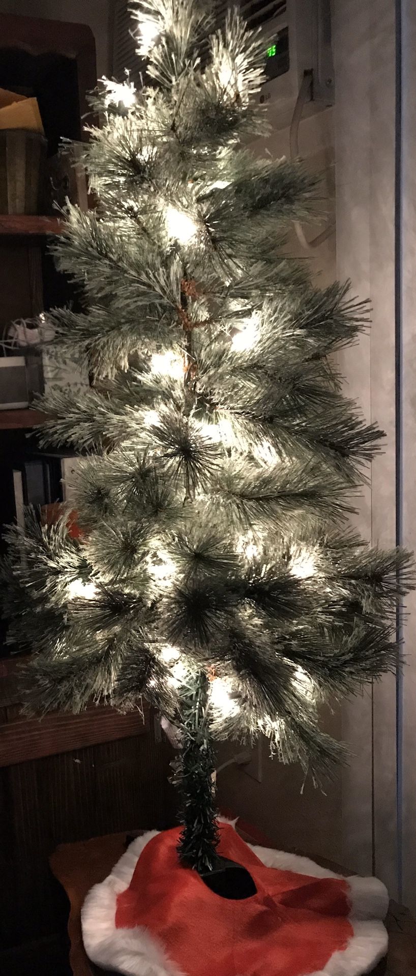 4.5 foot Canadian pine , pre-lit Christmas tree with skirt.