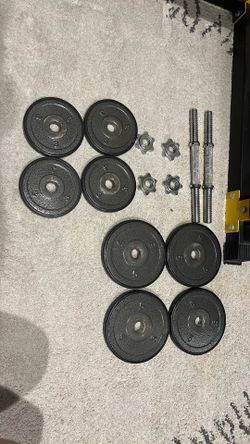 A pair of 16 LB adjustable dumbbells