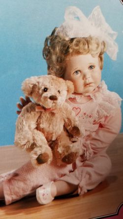 Porcelain little girl with teddy bear