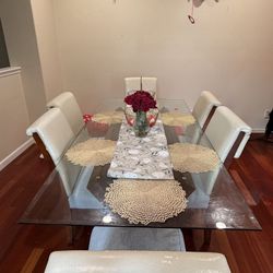 A Modern Big Grand Glass Dining Table With Chairs