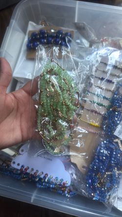 Entire box has jewelry , bracelets , anklets, belts , cups , keychains