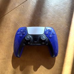 Blue and black ps5 controller