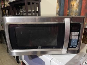 Oster 1100w 1.3 Cu Ft Microwave